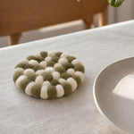 Cargar imagen en el visor de la Galería, Handmade felt coaster on a dining table