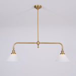 Cargar imagen en el visor de la Galería, Lámpara colgante Lumos de barra de latón con dos cabezales: iluminación arquitectónica moderna para isla de cocina