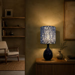 Load image into Gallery viewer, Blue gold patterned fabric table lamp in a living room