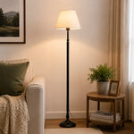 Charger l'image dans la visionneuse de galerie, Vintage black floor lamp shown in a quiet evening interior
