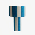 Cargar imagen en el visor de la Galería, Blue and white striped woven shade table lamp on a white background
