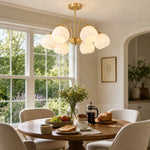 Load image into Gallery viewer, Six-arm chandelier above a breakfast table