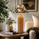 Bild in Gallery-Viewer laden, Woven rattan table lamp on a living room side table