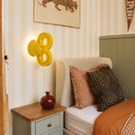 Bild in Gallery-Viewer laden, Yellow wall light beside a bed in a warm bedroom