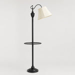 Load image into Gallery viewer, Full view of vintage black arc floor lamp with beige fabric shade and round side table