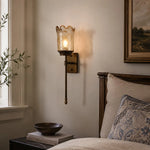 Load image into Gallery viewer, Vintage brass wall sconce installed beside a bedroom wall