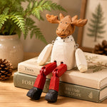Cargar imagen en el visor de la Galería, Hand-carved wooden christmas reindeer with red legs ornament styled on a tabletop edge