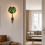 Load image into Gallery viewer, Resin leaf sconce in a warm architectural scene
