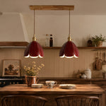 Load image into Gallery viewer, Two brown leather pendant lights above a dining table