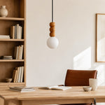 Bild in Gallery-Viewer laden, Wood bead globe pendant above a quiet home office desk