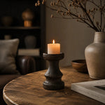 Load image into Gallery viewer, Solid wood candle holder in a dark neutral tabletop scene; candle not included