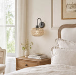 Bild in Gallery-Viewer laden, Woven rattan wall sconces in a serene bedroom