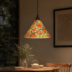 Bild in Gallery-Viewer laden, Orange floral pendant illuminating tea table in evening interior