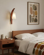 Cargar imagen en el visor de la Galería, Curved walnut and frosted glass plug-in wall lamp above a desk