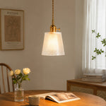Cargar imagen en el visor de la Galería, Style B fine-ribbed glass pendant above a quiet reading corner