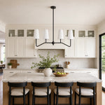 Bild in Gallery-Viewer laden, Strellux black linear chandelier above a kitchen island
