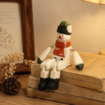 Cargar imagen en el visor de la Galería, Hand-carved wooden santa snowman ornament styled on a tabletop edge