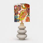 Bild in Gallery-Viewer laden, Sculptural floral fabric shade ceramic table lamp front view