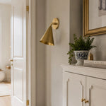 Load image into Gallery viewer, Natural brass wall light in a soft hallway setting