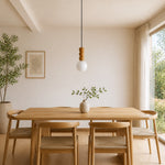 Bild in Gallery-Viewer laden, Wood bead globe pendant above a natural oak dining table