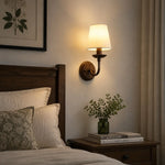 Bild in Gallery-Viewer laden, Warm bedside setting with an antique bronze wall sconce