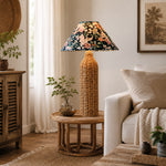 Bild in Gallery-Viewer laden, Tall rattan table lamp beside a neutral sofa