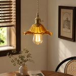 Cargar imagen en el visor de la Galería, Style L amber glass pendant glowing beside a rattan chair
