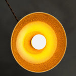 Bild in Gallery-Viewer laden, Underside view of the yellow ceramic glaze and open bulb area