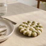 Cargar imagen en el visor de la Galería, Round felt coaster beside glassware