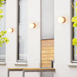 Load image into Gallery viewer, Asteroid Travertine Outdoor Wall Light