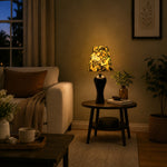 Load image into Gallery viewer, Black floral table lamp beside sofa
