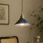 Bild in Gallery-Viewer laden, Blue ceramic pendant light beside a woven chair and wall art