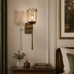 Load image into Gallery viewer, Brass amber glass wall sconce above a console table