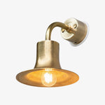 Charger l'image dans la visionneuse de galerie, Matte gold brass wall sconce with warm bulb glow