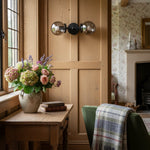 Cargar imagen en el visor de la Galería, Lámpara de tocador de baño moderna de estilo industrial Lumio Globe de cristal transparente