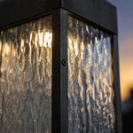 Cargar imagen en el visor de la Galería, Close-up of rippled clear shade and matte black wall light frame