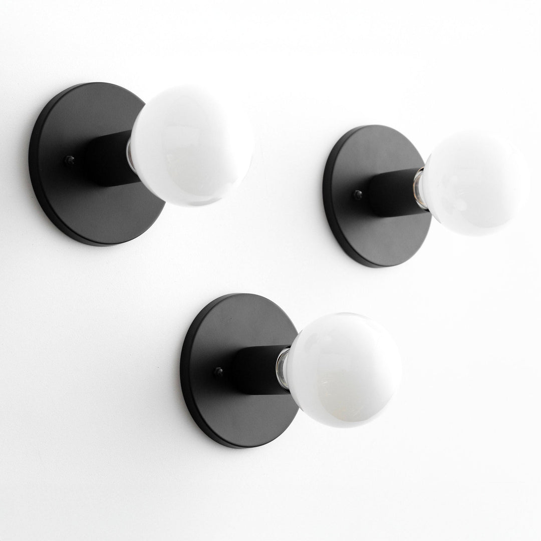 Aplique de pared minimalista de vidrio Glorica: una luz moderna y versátil para cualquier habitación