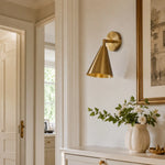 Load image into Gallery viewer, Natural brass wall light in a vintage entryway