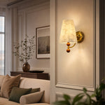 Bild in Gallery-Viewer laden, Capiz shell wall sconce glowing in an elegant paneled sitting room