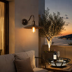 Load image into Gallery viewer, Outdoor wall sconce on a terrace wall at dusk