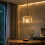 Charger l'image dans la visionneuse de galerie, Amber ripple glass pendant in a warm lounge corner