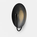 Load image into Gallery viewer, Black sculptural disc wall sconce