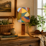 Load image into Gallery viewer, Colorful printed fabric table lamp in a styled interior