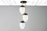 Load image into Gallery viewer, Tierlux Glass Tiered Skyscraper Shade Pendant – Art Deco Ceiling Light for Kitchen Island