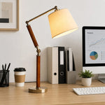 Cargar imagen en el visor de la Galería, Solid wood table lamp illuminating a neat home office desk