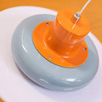 Load image into Gallery viewer, Close-up of glossy orange top and sea salt blue shade detail