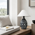 Bild in Gallery-Viewer laden, Ceramic table lamp beside a bright seating area