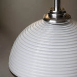 Load image into Gallery viewer, Close detail of the white ribbed shade and metal socket