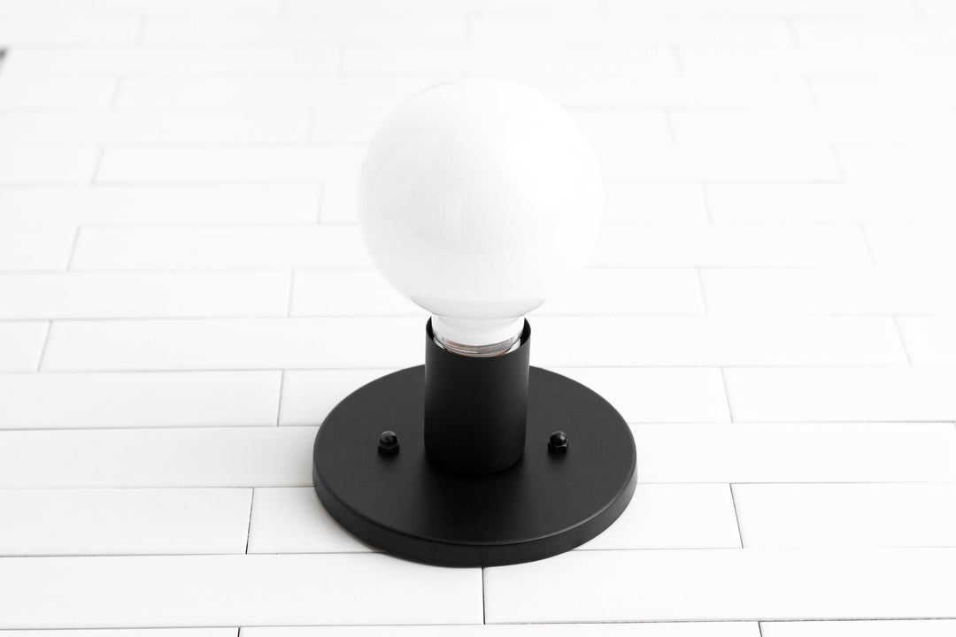 Aplique de pared minimalista de vidrio Glorica: una luz moderna y versátil para cualquier habitación