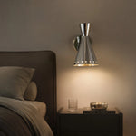 Cargar imagen en el visor de la Galería, Warm bedside lighting from a polished metal wall sconce